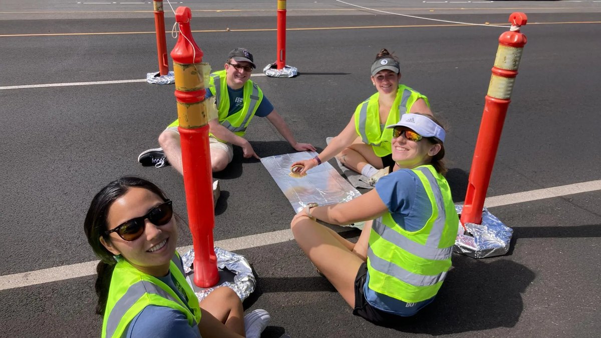 Researchers collect road dust samples from a section of road paved with recycled plastic-reinforced asphalt. Pictured left to right: Rachel Nakamoto, Simon Williams, Cara Megill and Cate Wardinski