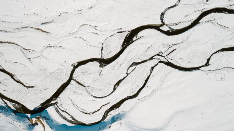 Snow covered Arctic river from above