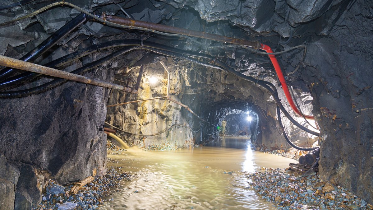 Underground mine tunnel with flowing water