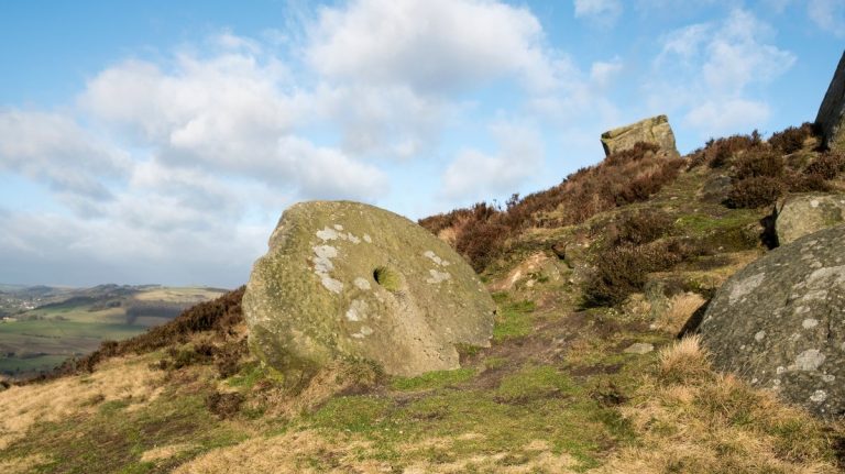 Abandoned rock quarry landscape with large stone blocks