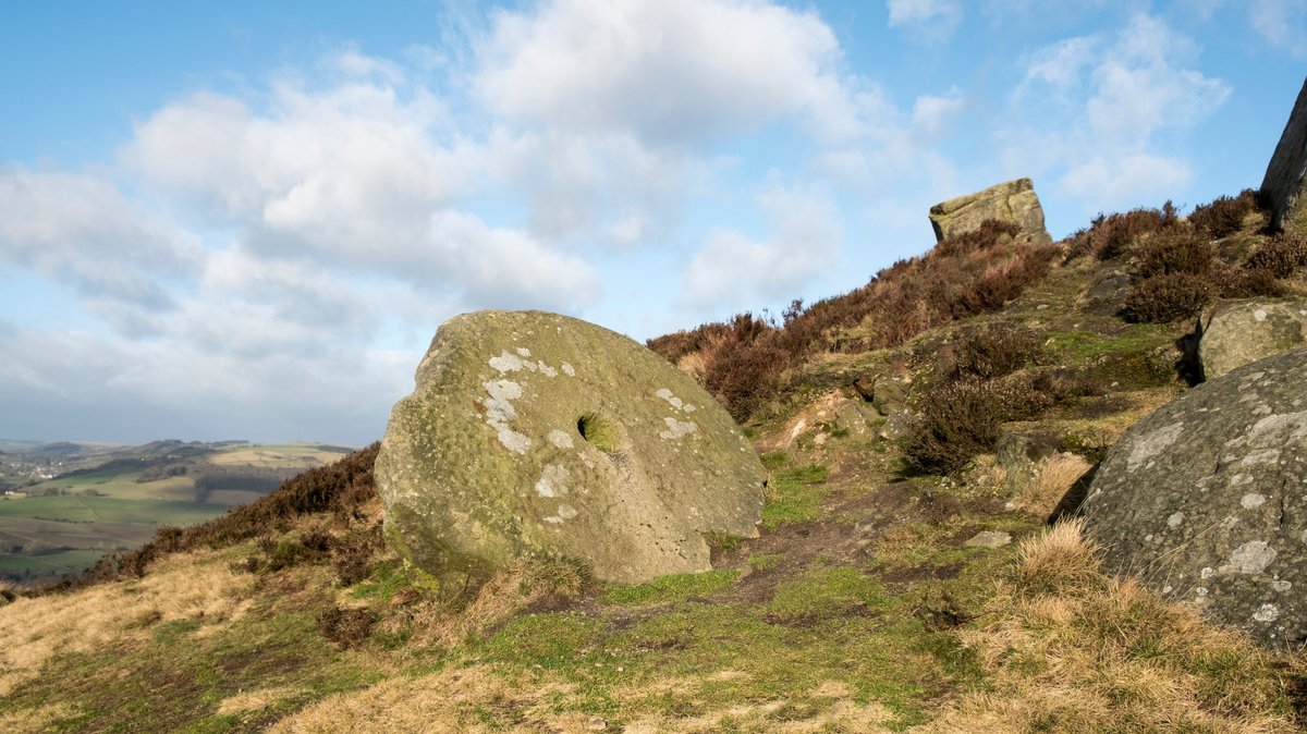 Abandoned rock quarry landscape with large stone blocks
