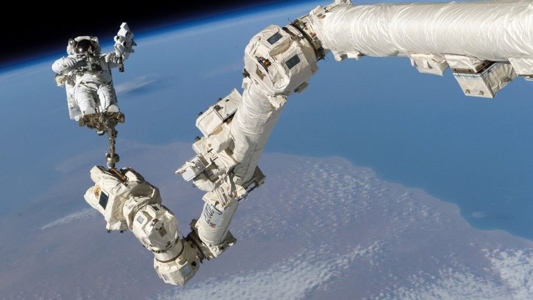 An astronaut during a spacewalk outside the International Space Station