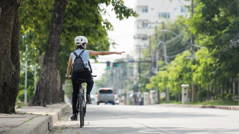 Cyclist and car traffic on a city street