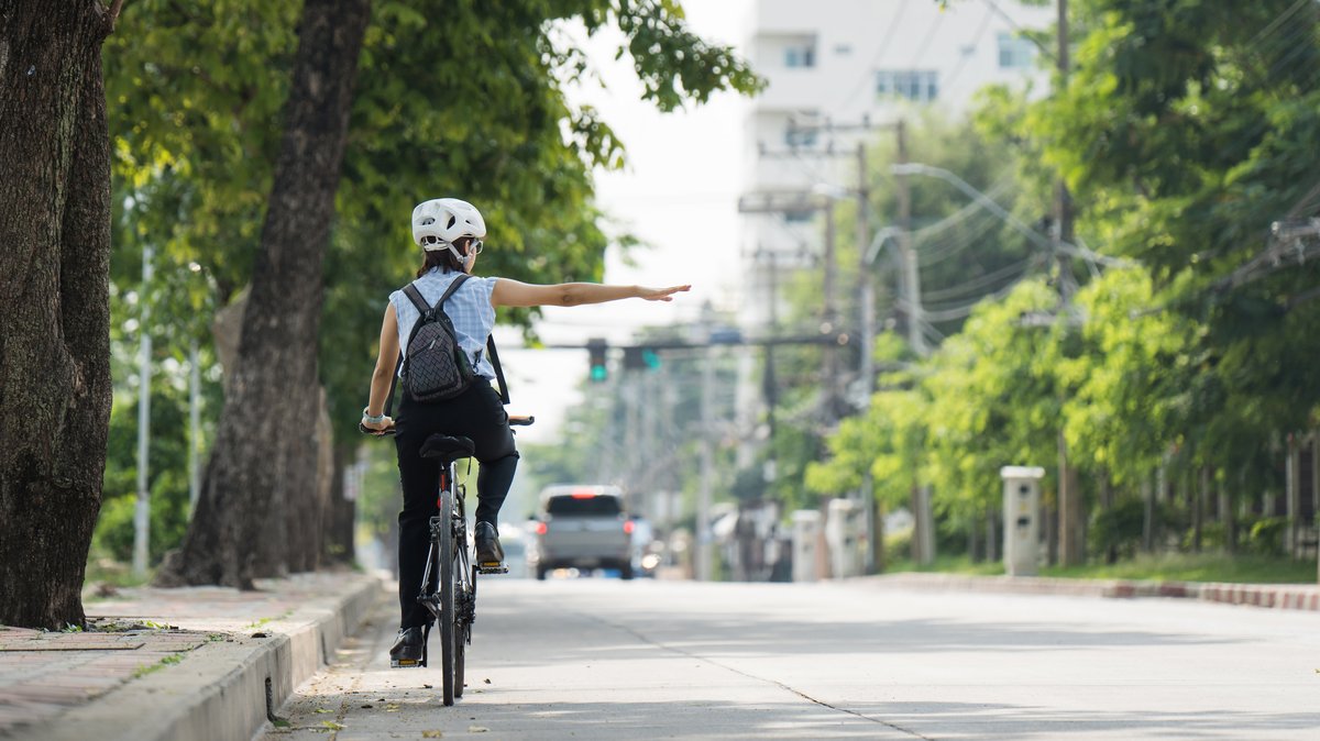 Cyclist and car traffic on a city street