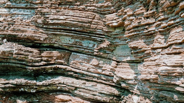 Close-up of stratified rock formation showcasing natural textures and layers