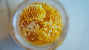 Honeycomb pieces preserved in a glass jar