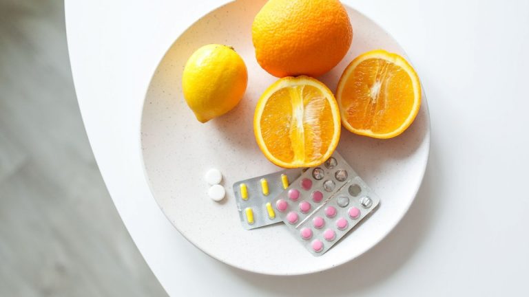 Citrus fruit and medicine packaging representing nutrition and healthcare