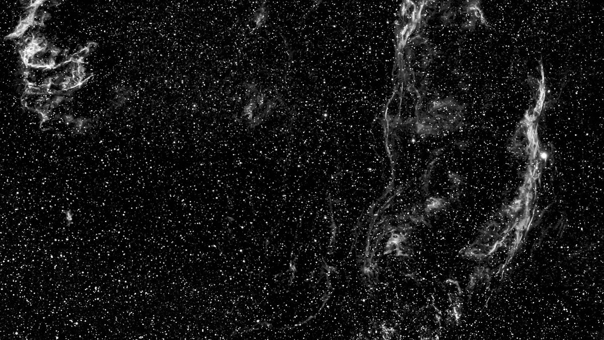 An awe-inspiring view of a supernova remnant amidst a field of stars in space