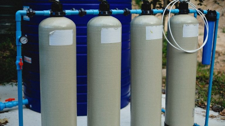 Water treatment tanks and pipes in a residential filtration system