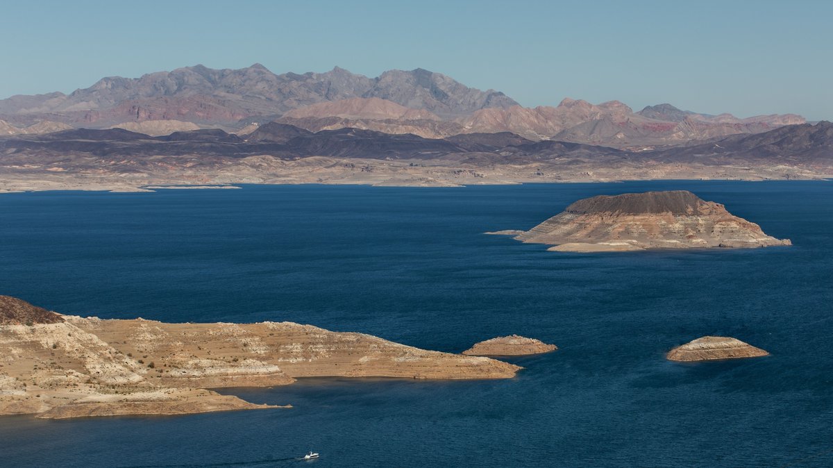 A desert reservoir surrounded by brown mountains in Arizona