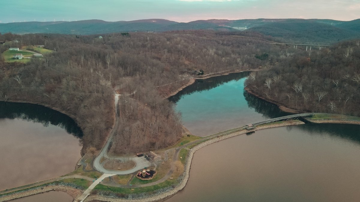 Aerial view of a large lake surrounded by forest