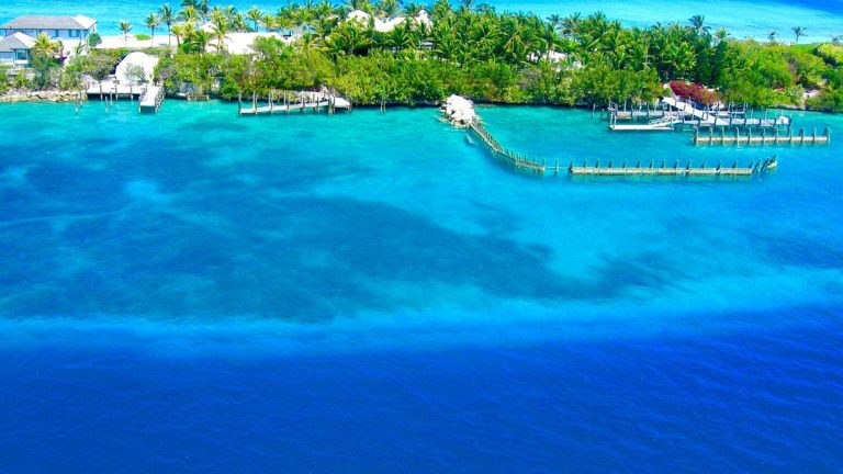 A breathtaking aerial view of Nassau, Bahamas showcasing vibrant blue waters and lush greenery