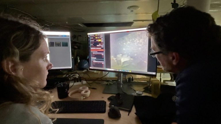 WHOI imaging specialists monitor real-time images of Shackleton’s Quest wreck on screens aboard R/V Atlantis.
