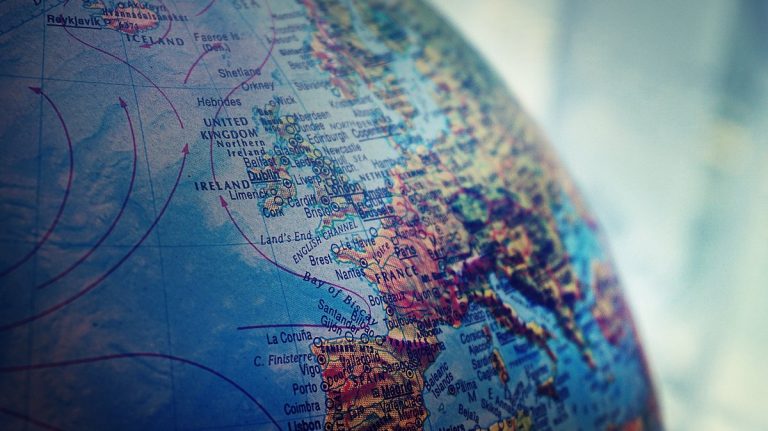 Detailed close-up of a globe showing parts of Europe and the Atlantic Ocean