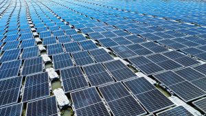 Aerial view of floating solar panels in Pasir Mas, Kelantan, illustrating renewable energy technology.