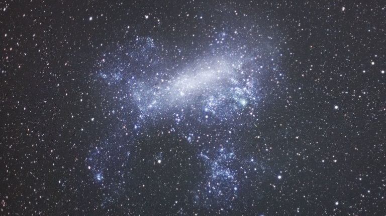 Capture of a galaxy cluster surrounded by a multitude of stars in the vast universe