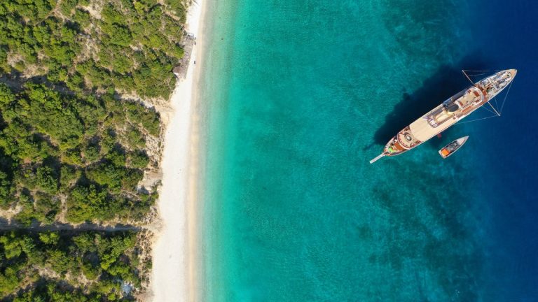 Aerial drone top down photo of beautiful paradise turquoise sea sandy beach and bay of Gidaki accessible by short hiking in beautiful Ionian island of Ithaki or Ithaca, Greece