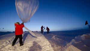 A scientific weather balloon being prepared for launch