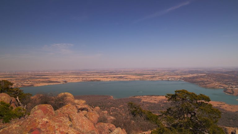 Breathtaking panoramic view of Lake Lawtonka and surrounding landscape from a mountain top in Oklahoma