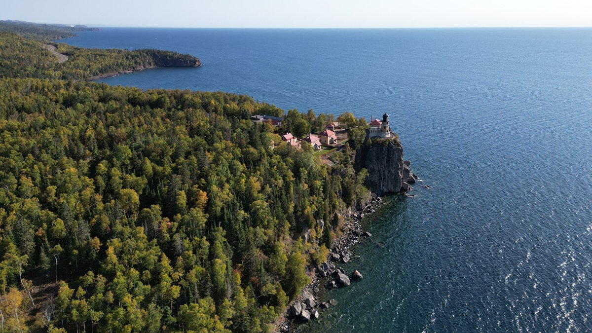 Split Rock Lighthouse above the forested shore of Lake Superior