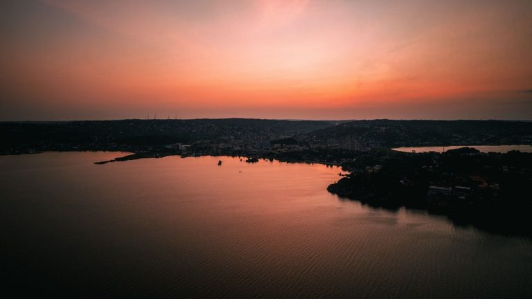 A breathtaking sunset over Lake Victoria in Mwanza, Tanzania, showcasing tranquil waters and vibrant skies