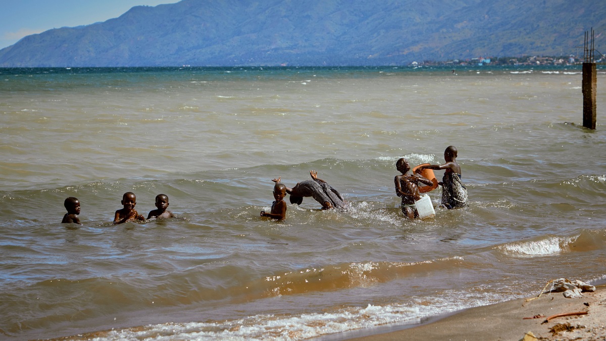 Joyful scene of children enjoying a sunny day in Lake Tanganyika, Africa