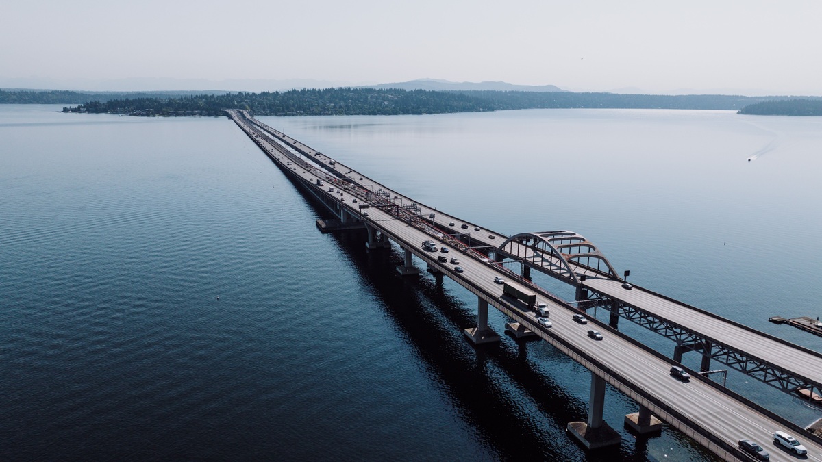 Stunning aerial shot of Seattle's floating bridge spanning Lake Washington, highlighting transportation and engineering marvel