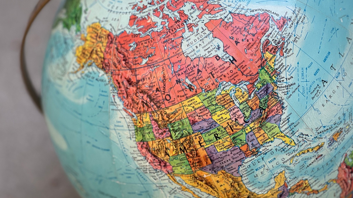 Detailed close-up of a vintage globe highlighting North America with vivid colors