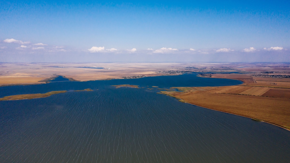 A large reservoir surrounded by open land, viewed from above