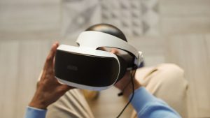 Hands holding VR headset for immersive virtual reality experience