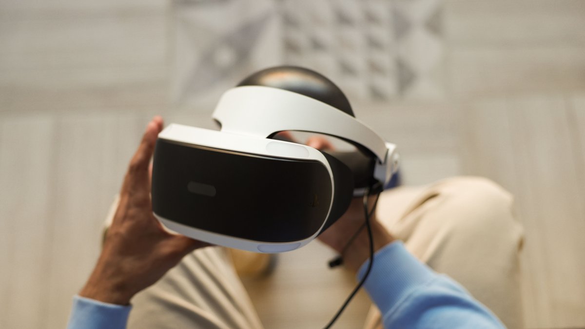 Hands holding VR headset for immersive virtual reality experience