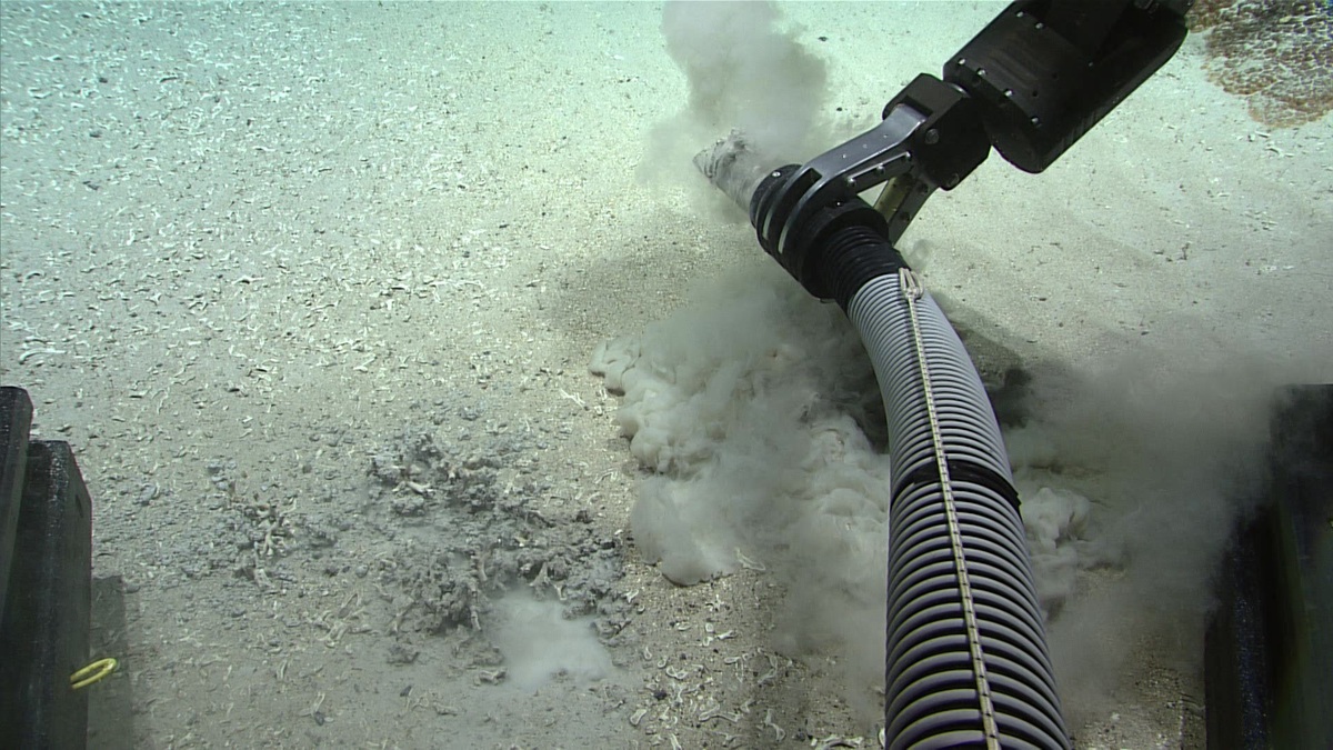 A NOAA remotely operated vehicle sampling sediment on the ocean floor