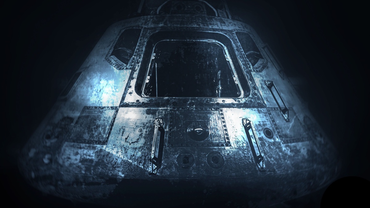 A dramatic monochrome image of an old space capsule in dim light, showcasing space exploration history