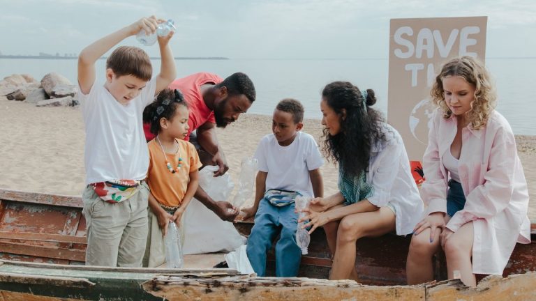 Volunteers and children participate in a beach cleanup, promoting environmental awareness