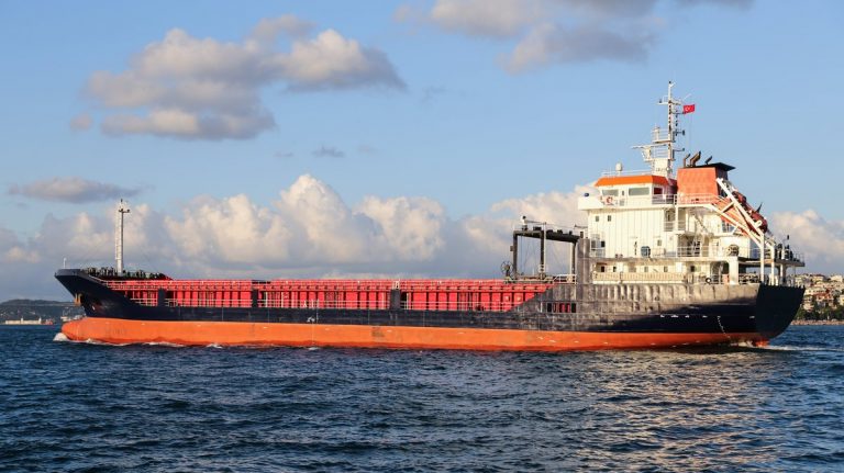 A cargo ship carrying goods between ports