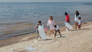 Volunteers collecting litter from an ocean beach