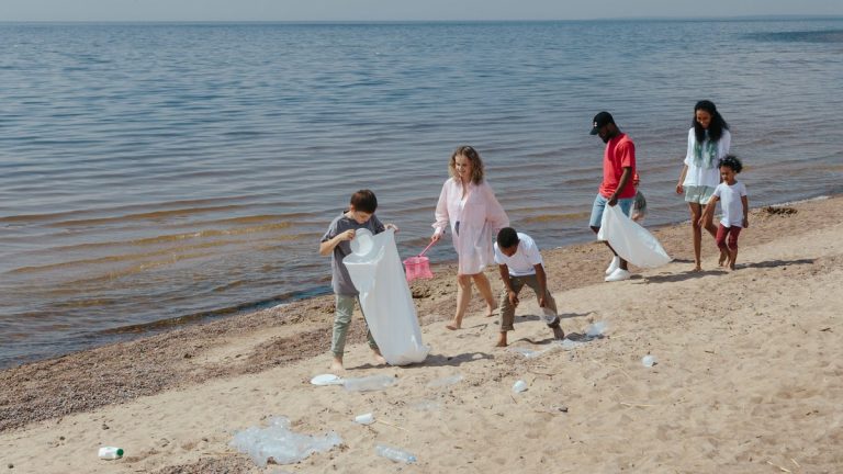Volunteers collecting litter from an ocean beach