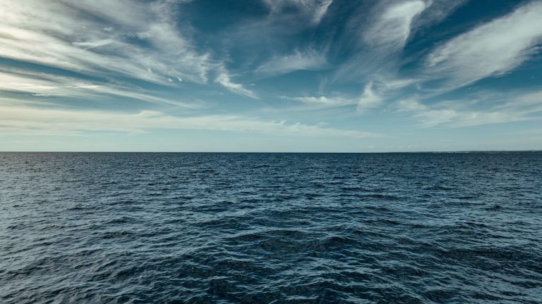 Tranquil seascape with blue sky and clouds over the ocean, captured in Poreč, Croatia