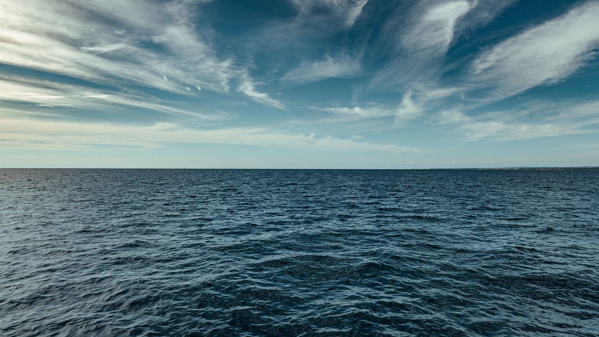 Tranquil seascape with blue sky and clouds over the ocean, captured in Poreč, Croatia