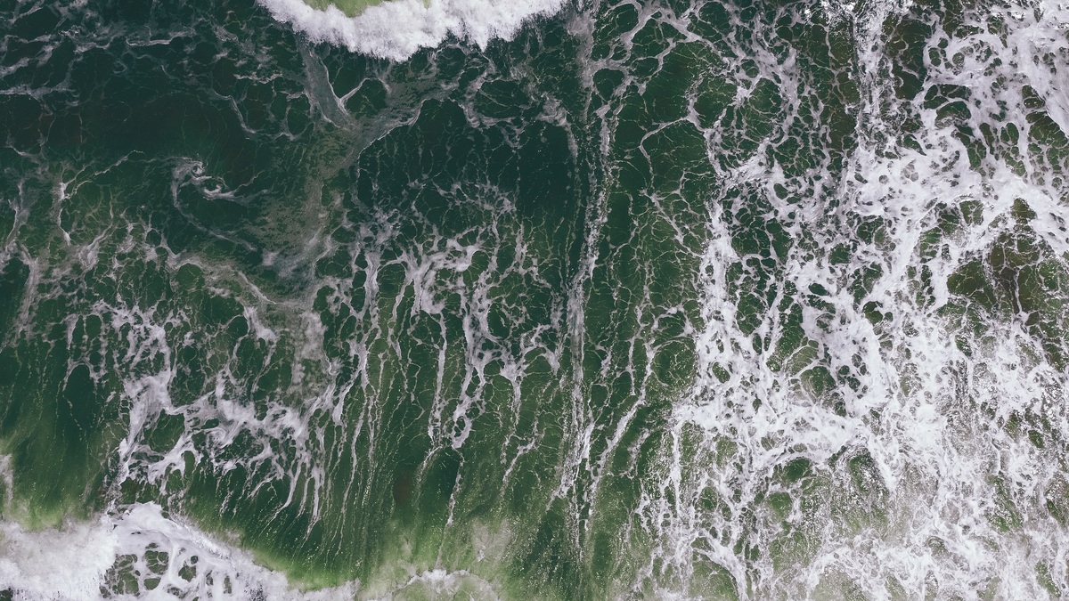 Stunning aerial view capturing the intricate patterns and textures of ocean waves
