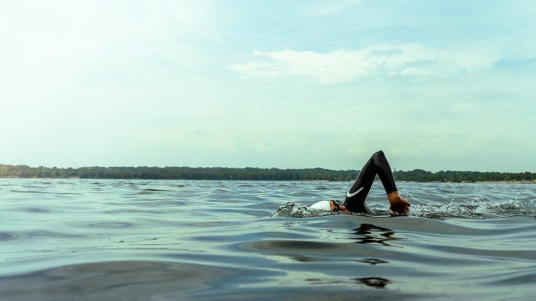 Professional triathlete swimming in open water
