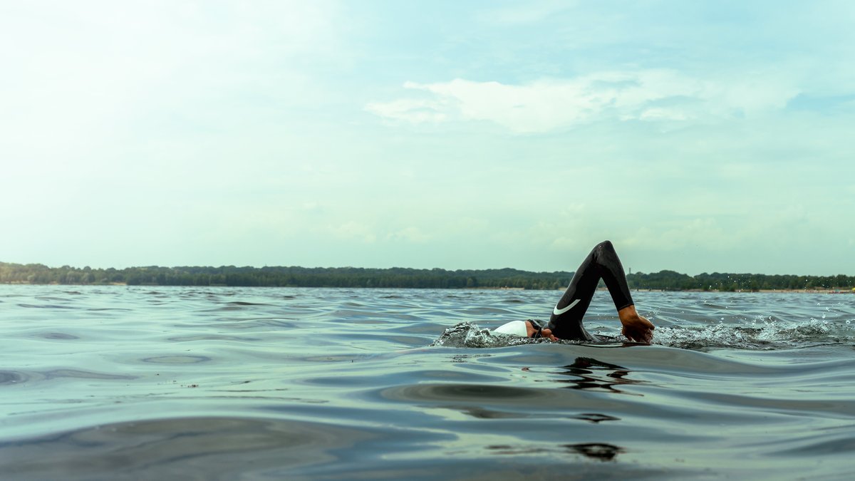 Professional triathlete swimming in open water