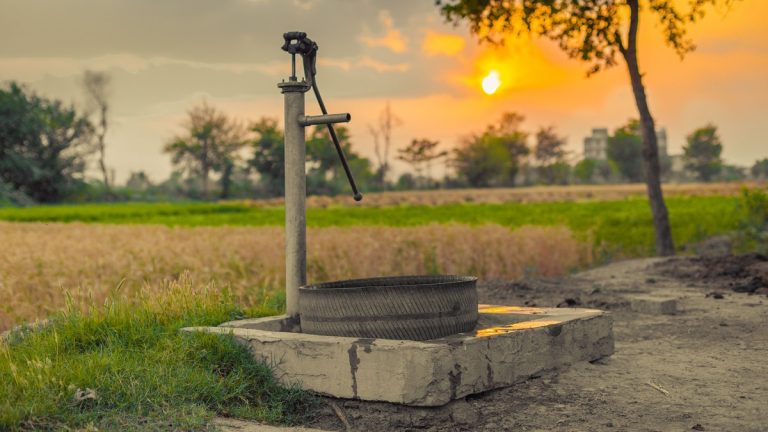 Rural_hand_pump_at_sunset