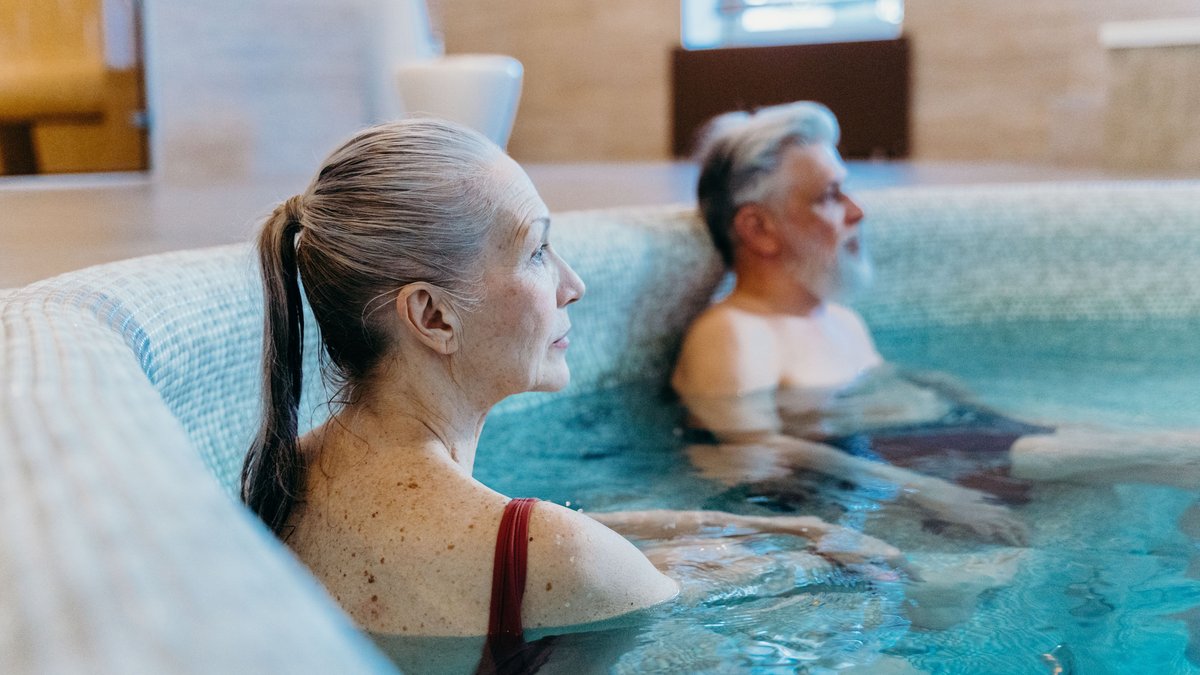 Older adults exercising together in an indoor swimming pool