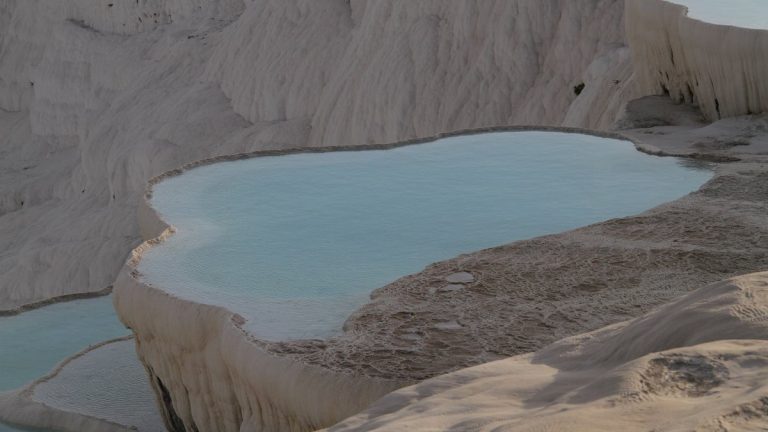 Breathtaking view of Pamukkale's travertine terraces with mineral-rich thermal waters