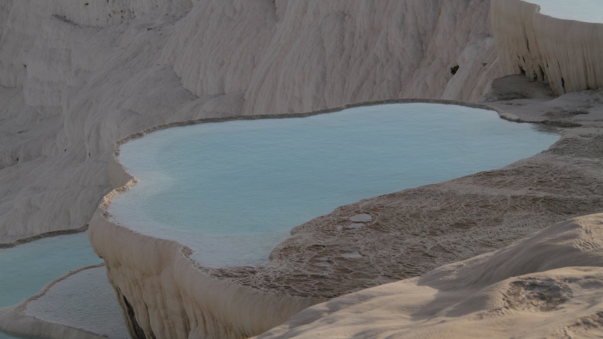 Breathtaking view of Pamukkale's travertine terraces with mineral-rich thermal waters
