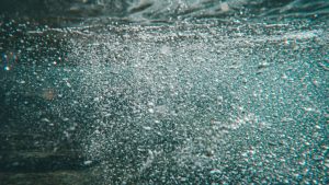 A mesmerizing close-up of bubbles in underwater scenery, creating a dynamic visual