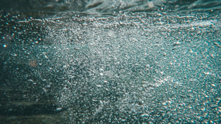 A mesmerizing close-up of bubbles in underwater scenery, creating a dynamic visual