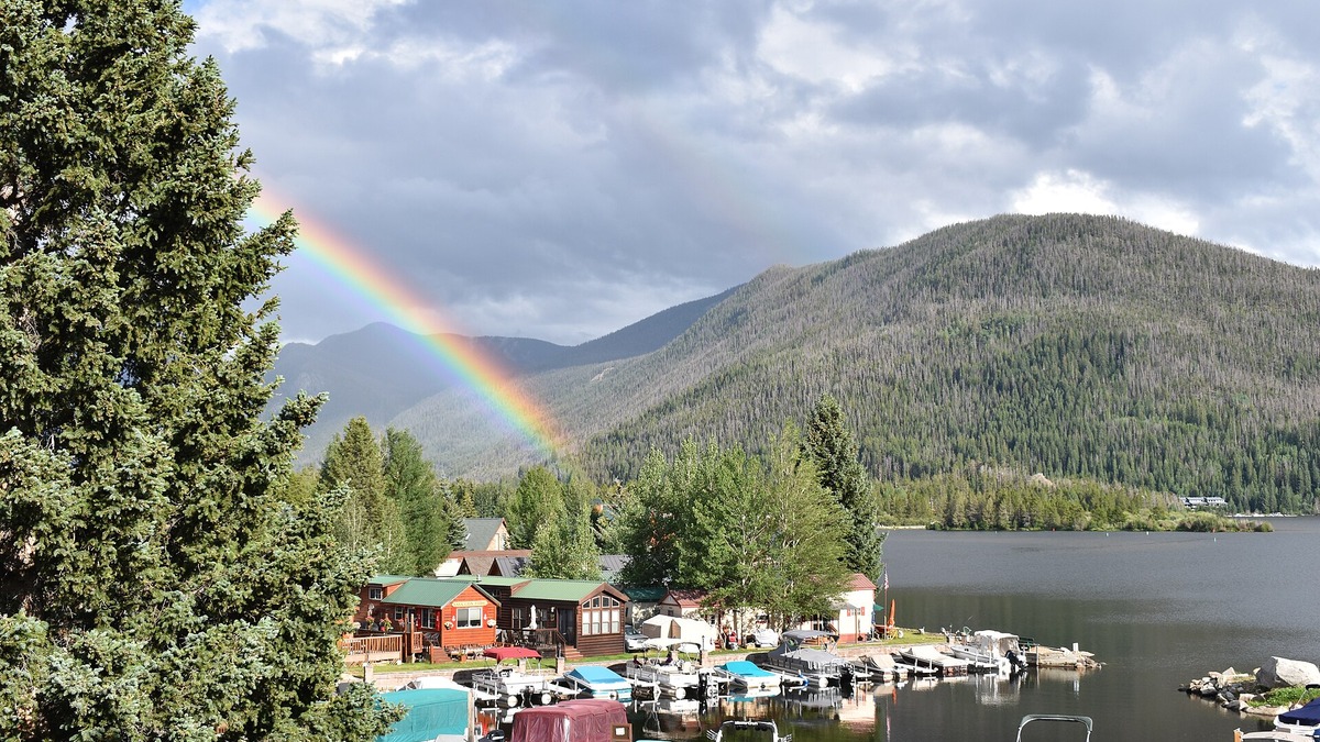 Grand Lake in Colorado beneath a rainbow