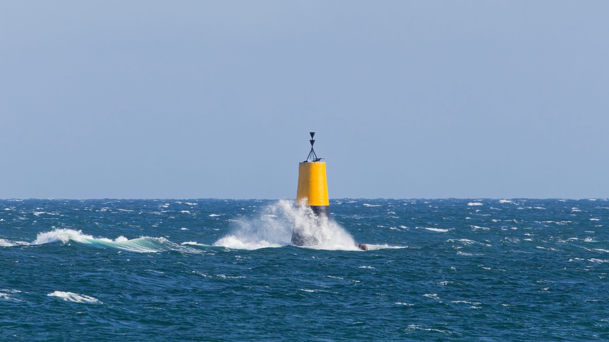 Yellow_buoy_among_ocean_waves